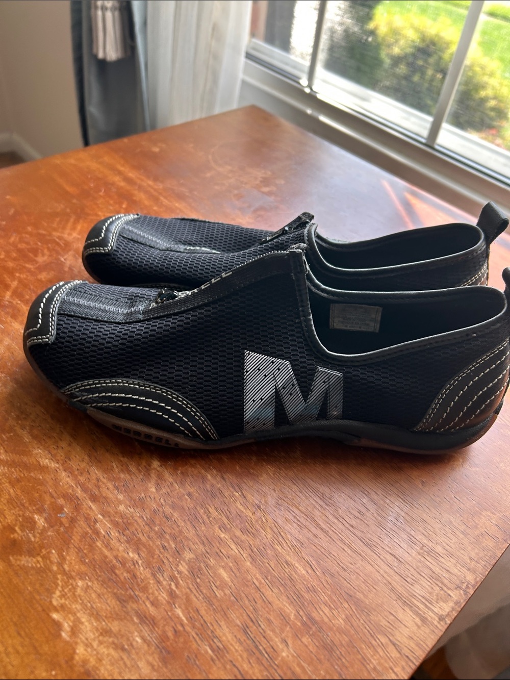 Ladies, black slip on Merrell shoes